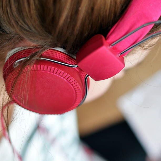 female wearing red headphones